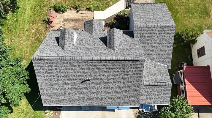 Genesis Roofing inspector at a residential property