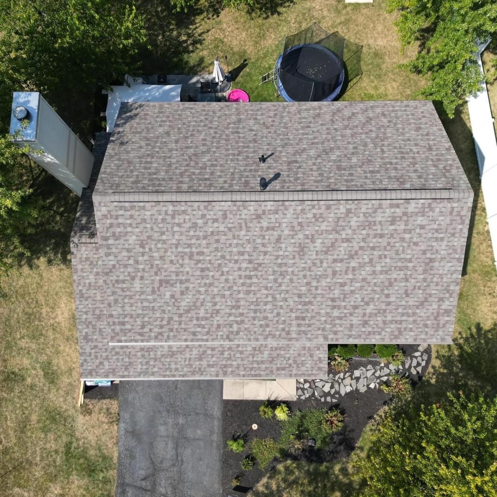 Aerial view of a beautifully completed Genesis Roofing residential installation