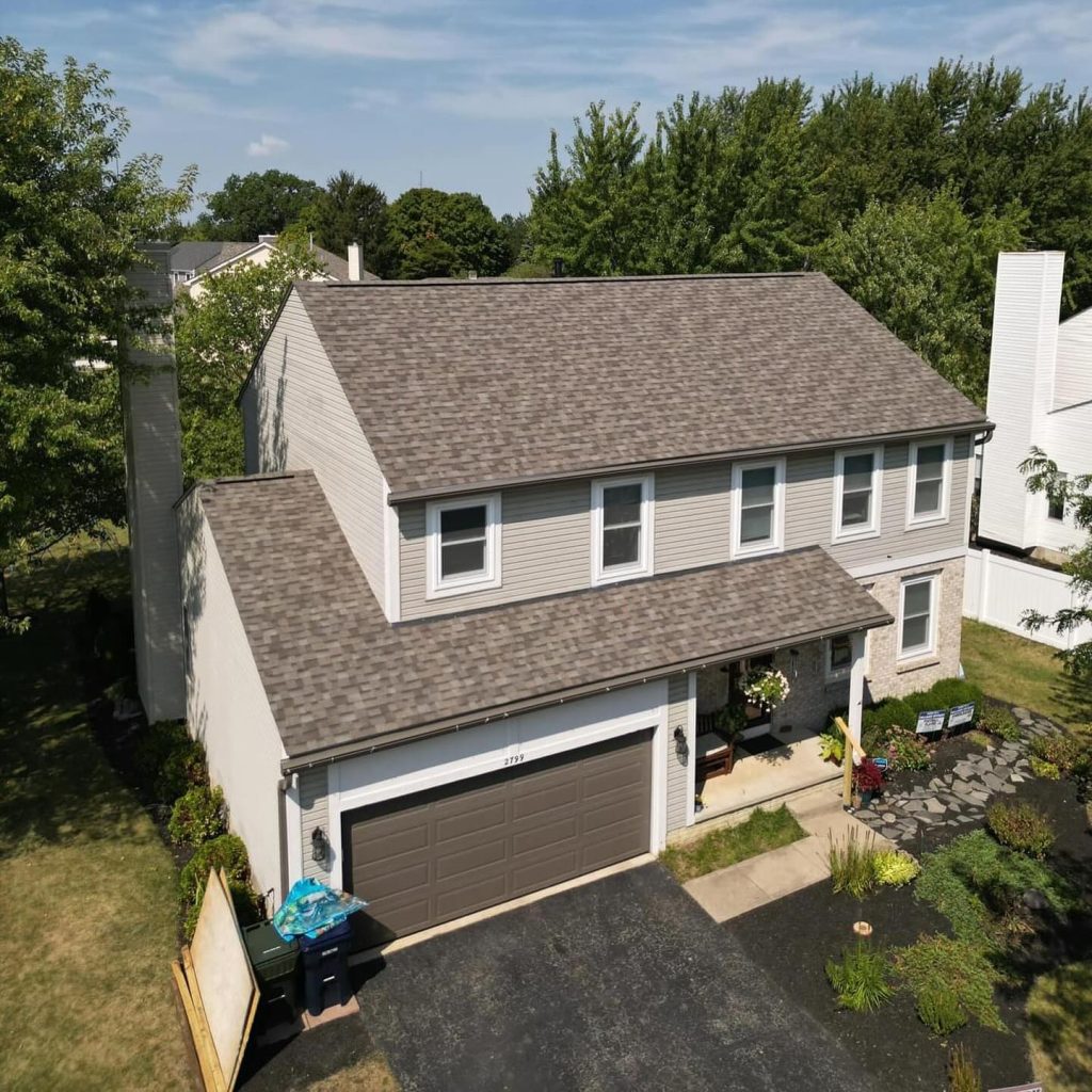 Genesis Roofing crew working on a residential roof installation